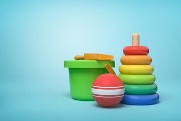 Children's beach toys arranged on blue background