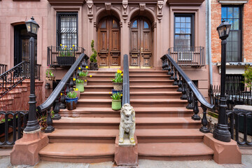 Brownstones with stoop steps in Chelsea Historic District. Row of Townhouses Manhattan, New York City - 786279033