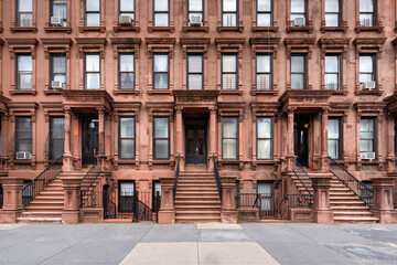 Harlem Brownstones with stoop steps in Mount Morris Park Historic District. Row of Townhouses in Manhattan, New York City