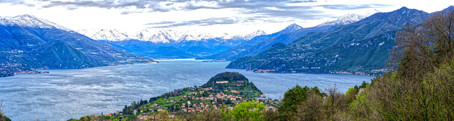 Lake Como village Bellagio panorama background snowy mountains in Italy, Europe