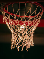 Fototapeta na wymiar an image capturing the warmth of light filtering through a basketball net