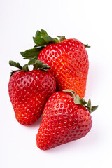 Close up of ripe strawberries on white background