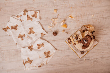 A close-up of scattered cake and cookies on a wooden table, symbolizing a joyful celebration.