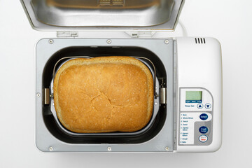 Finished bread loaf in bread maker machine - obrazy, fototapety, plakaty