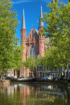 Gouda, Netherlands. View of Gouwekerk (formerly Sint-Jozefkerk, St. Joseph's Church) from Gouwe river. The church was built in 1902-1904 by design of architect Christianus Petrus Wilhelmus Dessing.