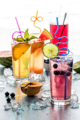 Icy fruit flavoured spritzers with selective focus on the one in front.