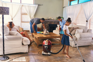 Family, chores and cleaning in living room by house as teamwork to learning responsibility at home. Father, children and working together by helping, bonding and cooperation for natural growth