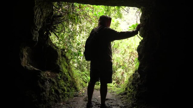 A man in a cave in the Laurisilva forest of Los tilos de Moya, Gran Canaria