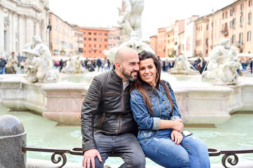 Happy  Beautiful Tourists  couple traveling at Rome, Italy, taking a selfie portrait аt Piazza...