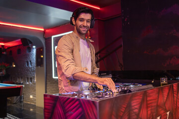 Joyful Friends Dancing at a Club with DJ