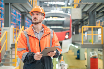 Portrait of a male engineer Take care of the electric locomotive maintenance shop