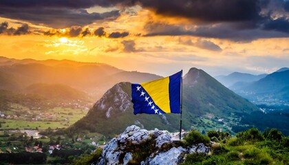 The Flag of Bosnia and Herzegovina On The Mountain. - obrazy, fototapety, plakaty
