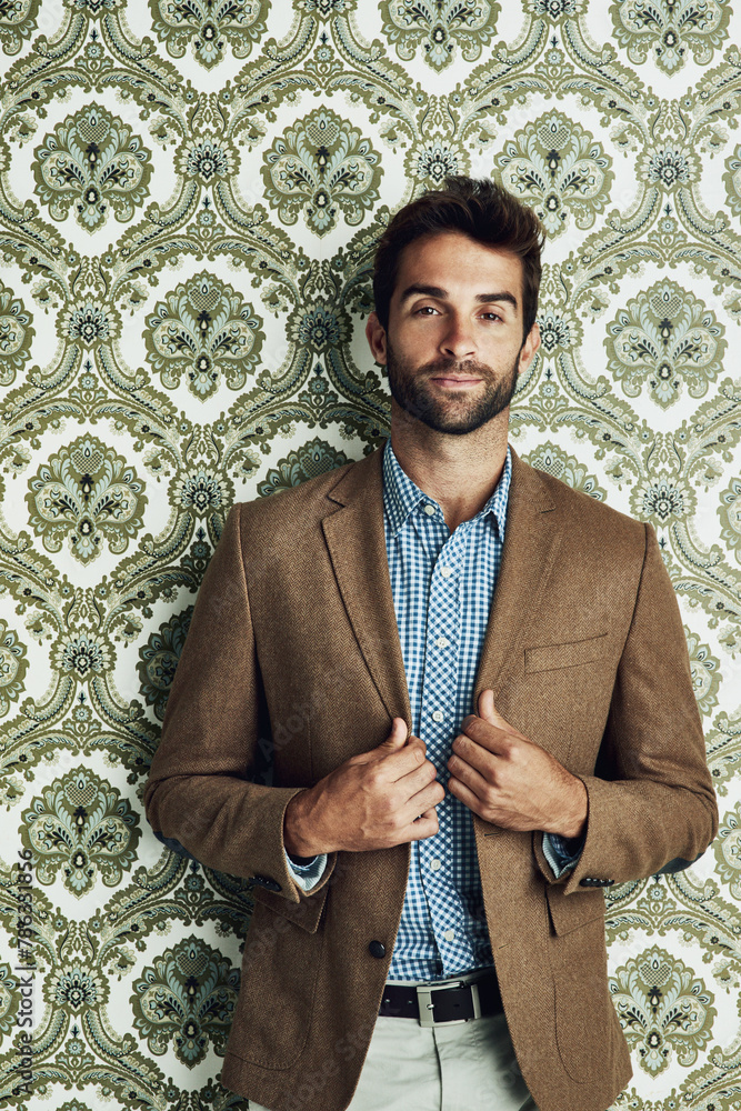 Poster man, portrait and fashion on wallpaper or stylish confidence with suit jacket with pattern backgroun