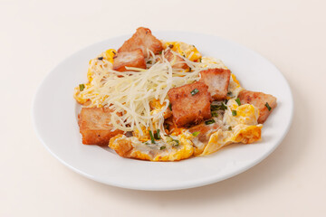 Bot Chien also known as Vietnames fried rice flour cake with eggs, Vietnamese food isolated on white background, close-up