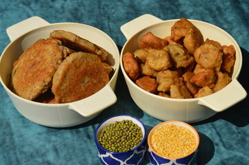 Bhalla,bada pakodi  badi are a popular snacks,deep fried urd and moong dal dumplings served  with delicious chutneys and pickle  .Almost in every festival and functions it is used as special dish.