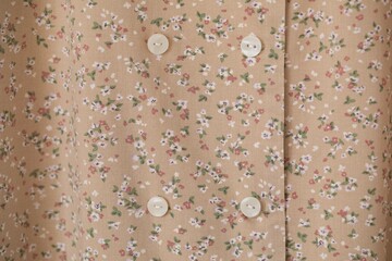 Full frame of Buttons down shirt.close up.floral background.
