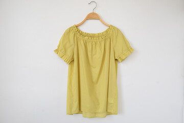 Yellow dress on hangers