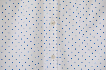 Full frame of Buttons down shirt.close up.polka dot background.