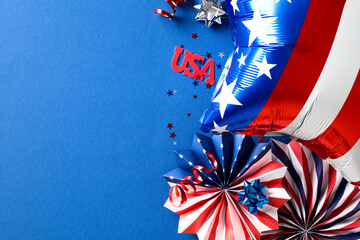 4th of July, Happy Independence day background. Flat lay American flag color paper fans and balloon on dark blue desk.