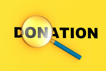 Donation word under magnifying glass