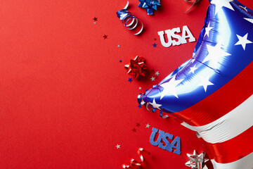 USA Independence Day 4th of July concept. Flat lay composition with balloon and party streamers on...
