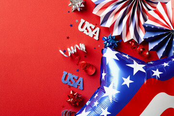 4th of July, Happy Independence day concept. Flat lay composition with American balloon, paper fans, signs USA on red background.