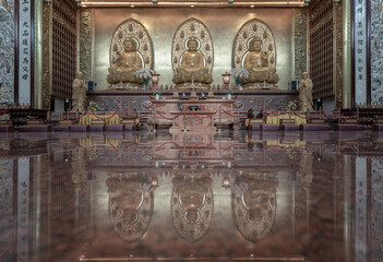 Three Buddha images inside Fo Guang Shan Thaihua Temple is famous place. Taiwanese temple style,...