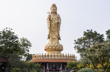Big Golden statue goddess of Mercy Guanyin or Quan Yin statue at Fo Guang Shan Thaihua Temple. Guan Yin Buddha, Taiwanese temple style, Space for text, Selective focus.