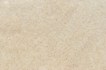 A sheet of beige recycled cardboard texture as background