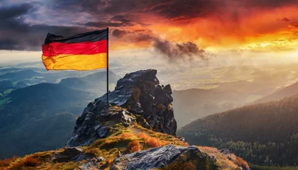 Schilderijen op glas The Flag of Germany On The Mountain. © Daniel