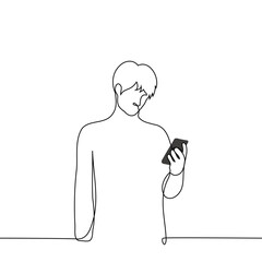 one man stands looking at the screen of his phone - one line vector. male smartphone user