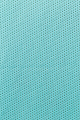 Abstract cloth woven texture pattern background in teal cyan blue.