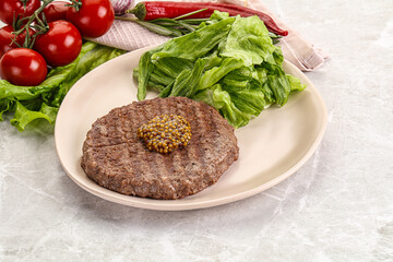 Frilled beef burger cutlet with iceberg