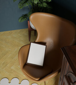 30x40 wooden frame mockup poster standing on the orange egg chair in the interior