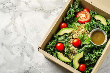 Kale quinoa salad with avocado slices and cherry tomatoes in a takeout box.