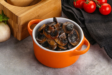 Roasted champignon mushrooms in the bowl