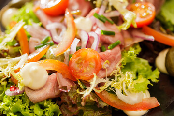 Fresh Vegetable Salad on black plate