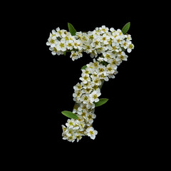 The number seven is made of delicate white flowers on a black background.