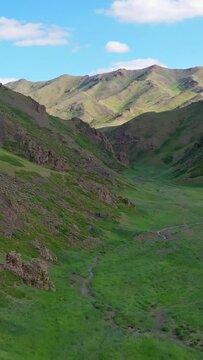 Aerial view of mountains landscape in Yol Valley, Mongolia. Vertical video