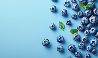 Fresh blueberry slices scattered on a soft blue background, with ample space on the left for text