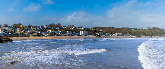 A view of the tide turning off the beach in the village of Saundersfoot, Wales on a bright spring...