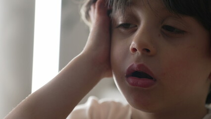 Bored young boy rolling eyes in deep annoyance, close-up face of one upset caucasian male 5...