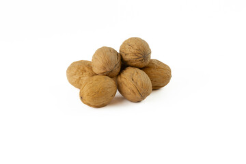 Heap of walnuts isolated on a white background