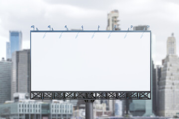 Obraz premium Blank white billboard on city buildings background at daytime, front view. Mockup, advertising concept