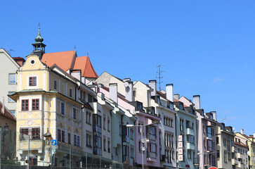Fototapeta na wymiar Old town of Bratislava, Slovakia on sunny spring day. Beautiful buildings, blossoming trees, street view. Architecture of central Europe. 