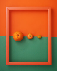 Orange, clementine and cherry tomato in  frame