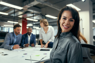 Group of happy multiracial business people talking around conference table during meeting in office - 786384692