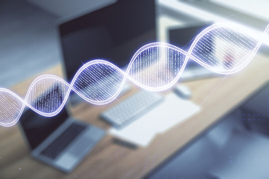 Creative light DNA illustration and modern desktop with pc on background, science and biology concept. Multiexposure