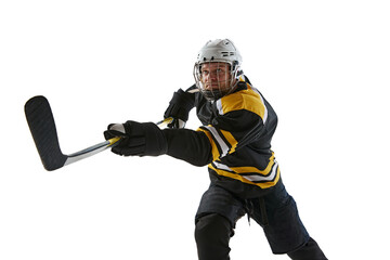 Competitive, concentrated man, hockey player with stick in motion during game, training isolated on white background. Concept of professional sport, competition, game, tournament