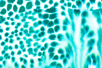 abstrakter Aquarellhintergrund mit grünen Tupfern wie ein Leopardenmuster

